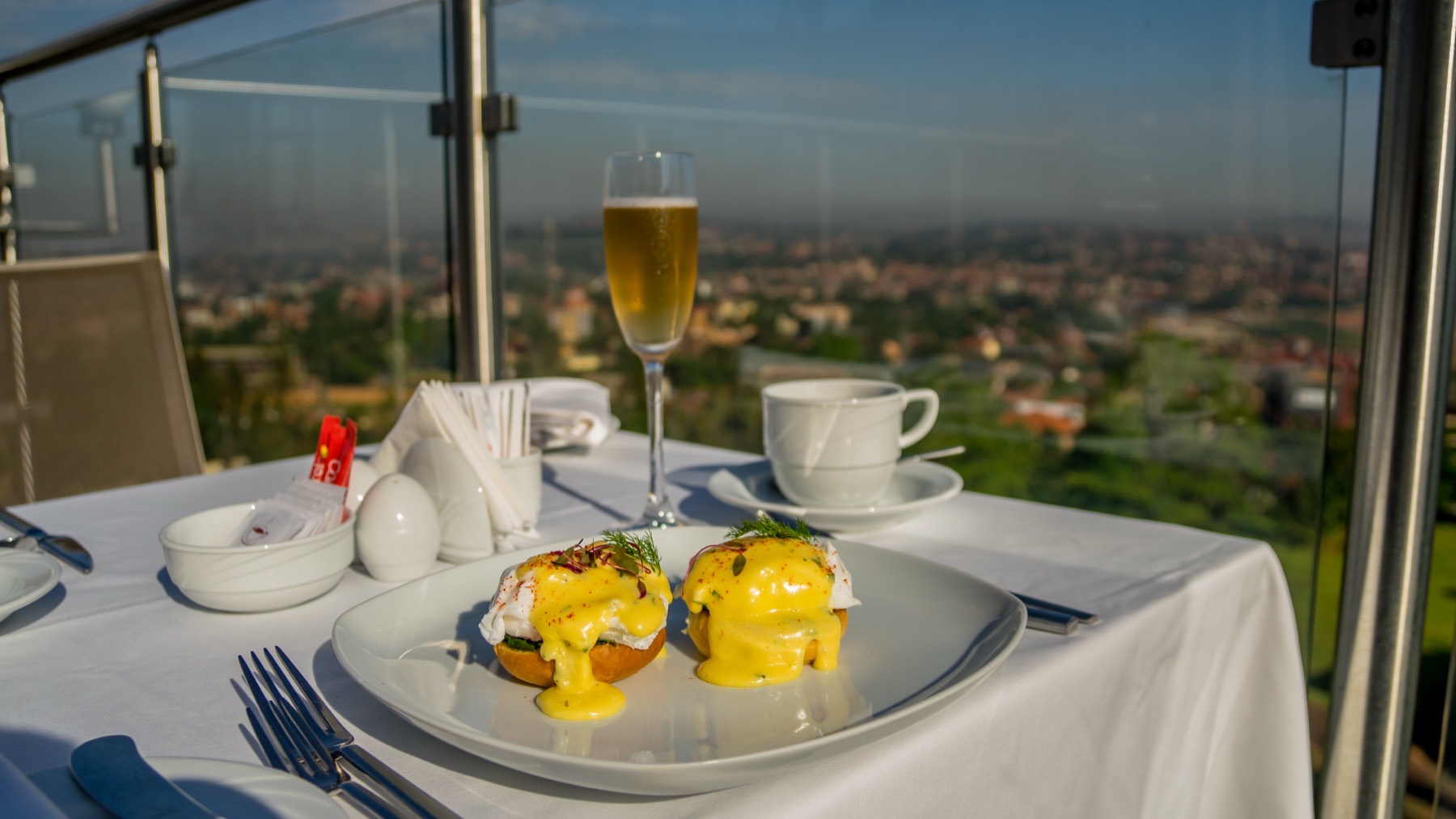 Fine dining beneath the curved gold ceiling with skyline windows