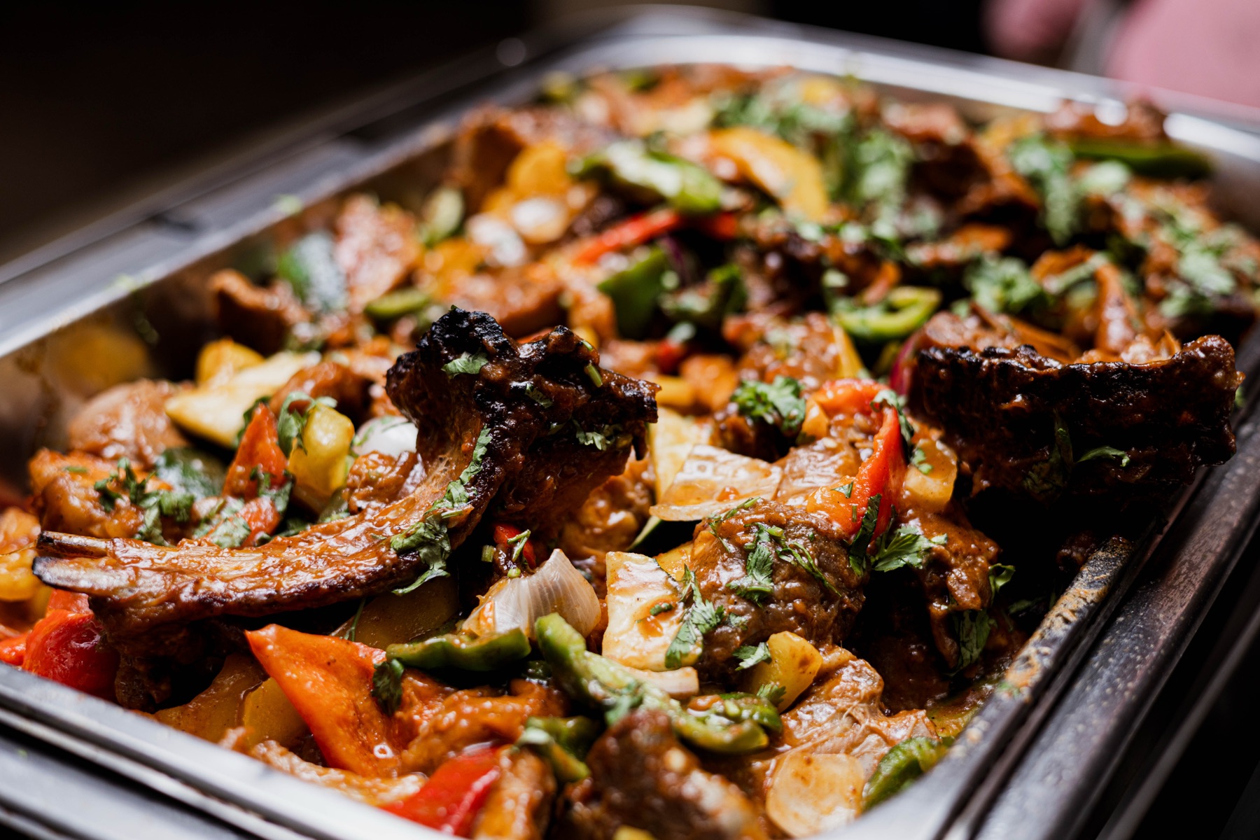 A hearty beef and vegetable stew with peppers and coriander in the buffet counter at Chapter Two Restaurant