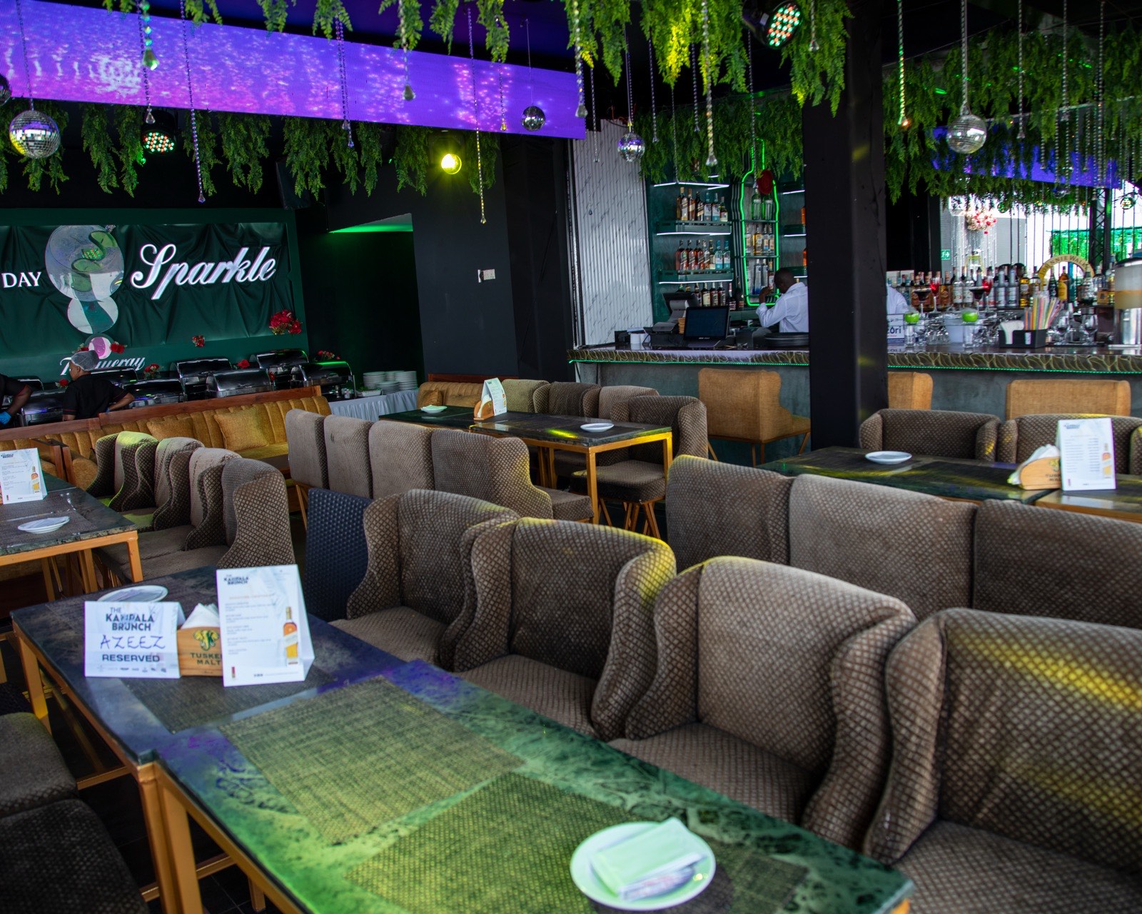 The lounge set up for The Kampala Brunch, with reserved tables and bar service, May 2024