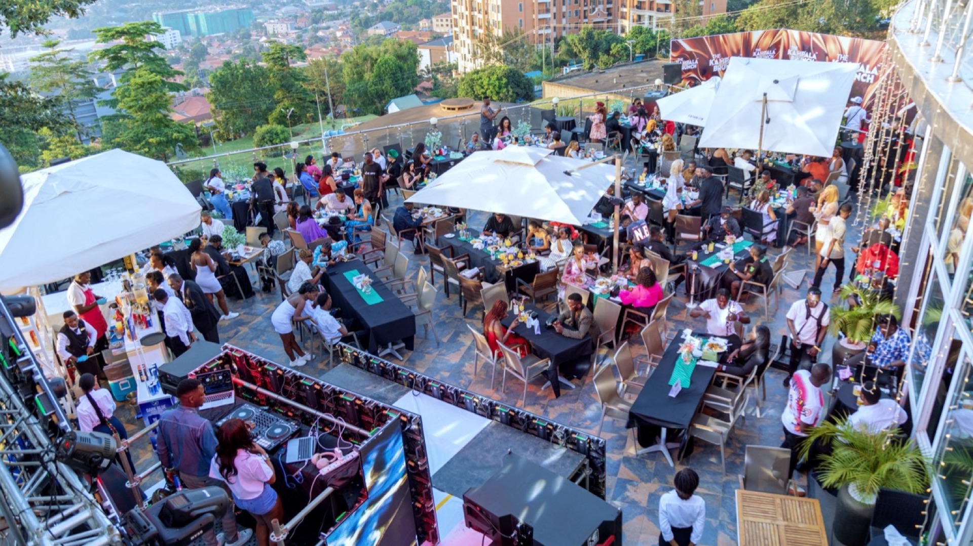 Lariza Terrace open-air rooftop with guests overlooking Kampala