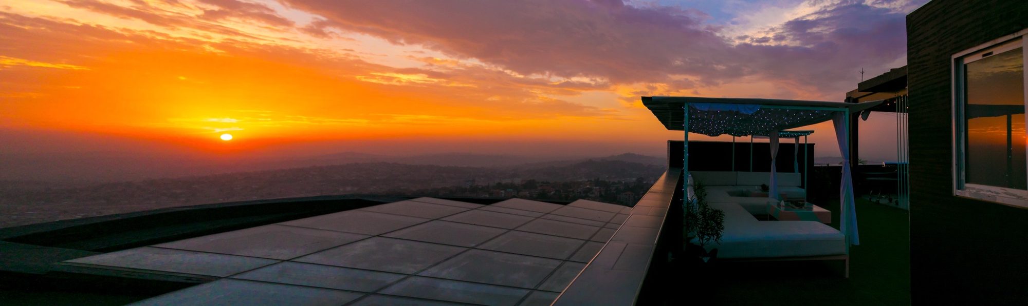 Panoramic sunset over Kampala from the rooftop at Skyz Hotel Kampala
