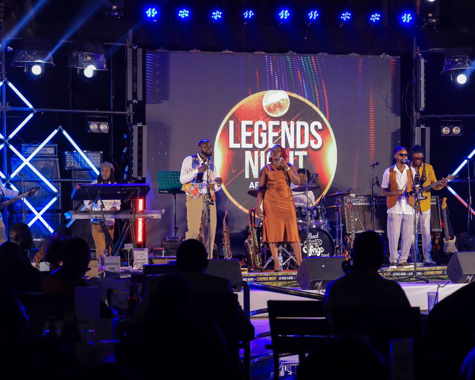 Afrigo Band's horn section and singers performing at Legends Night
