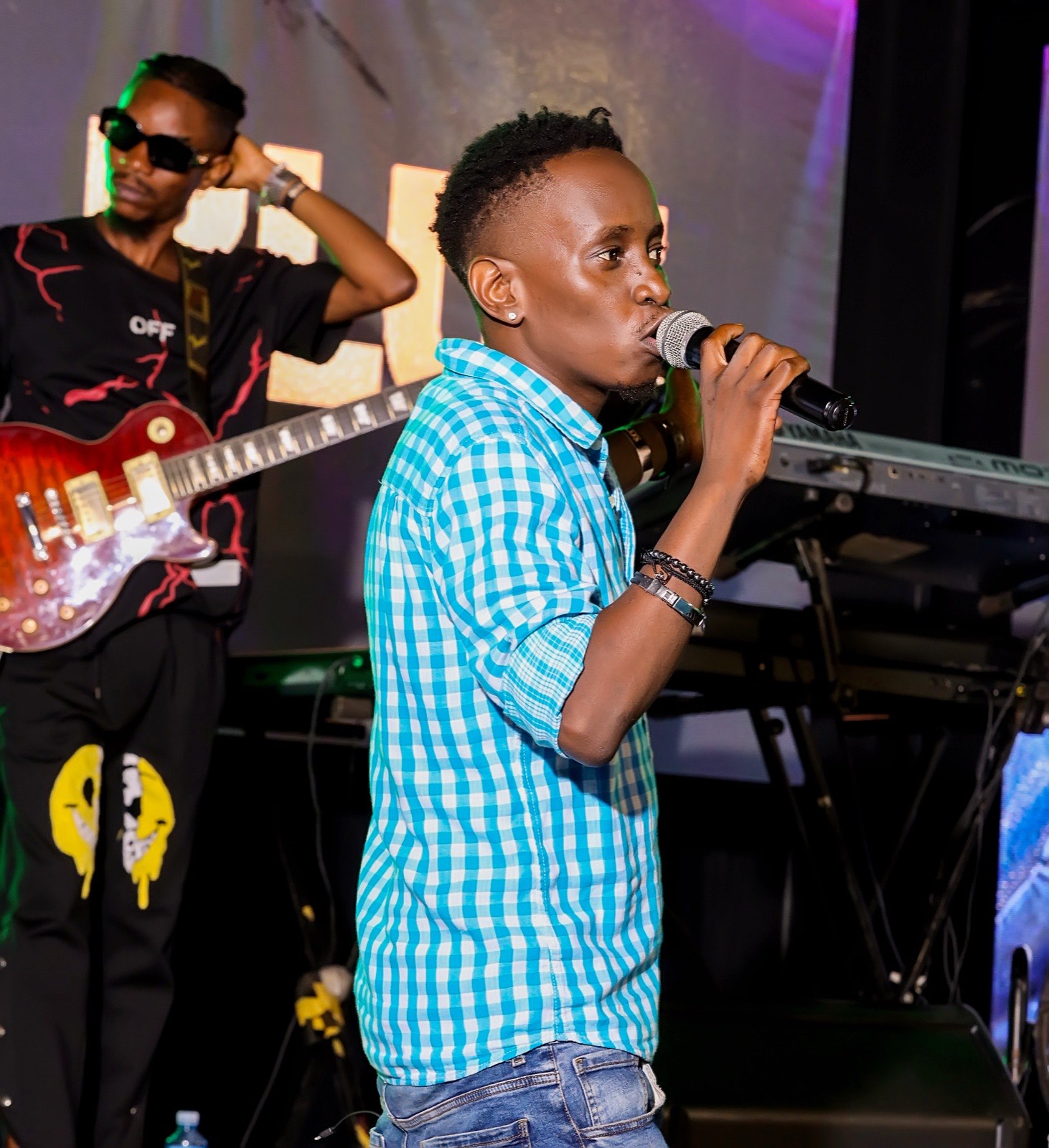 BLU3 singing on stage at Tropicanna Poolside