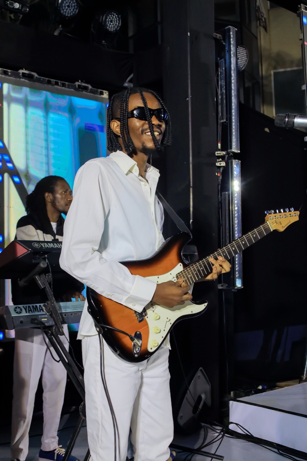 D'Maestroz Band's lead guitarist performing at The Skyz Exclusive