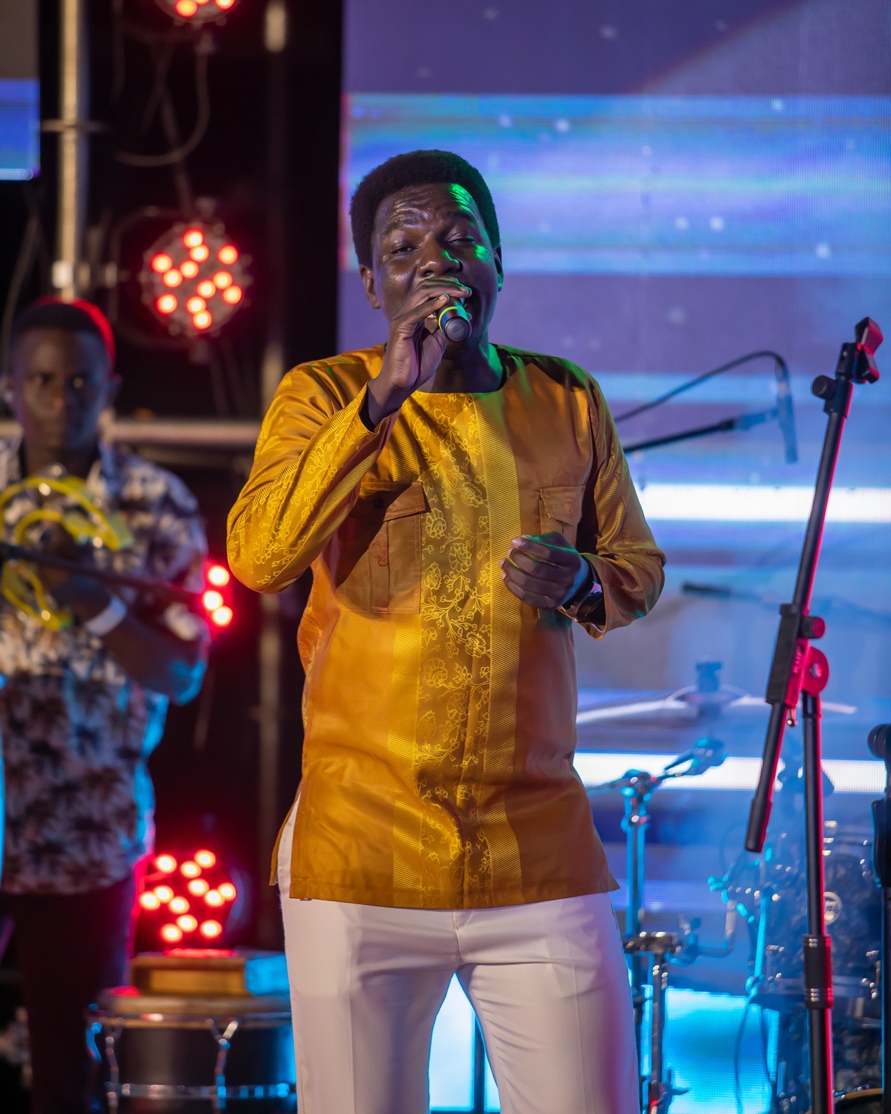 Kenneth Mugabi under stage lights at The Skyz Exclusive