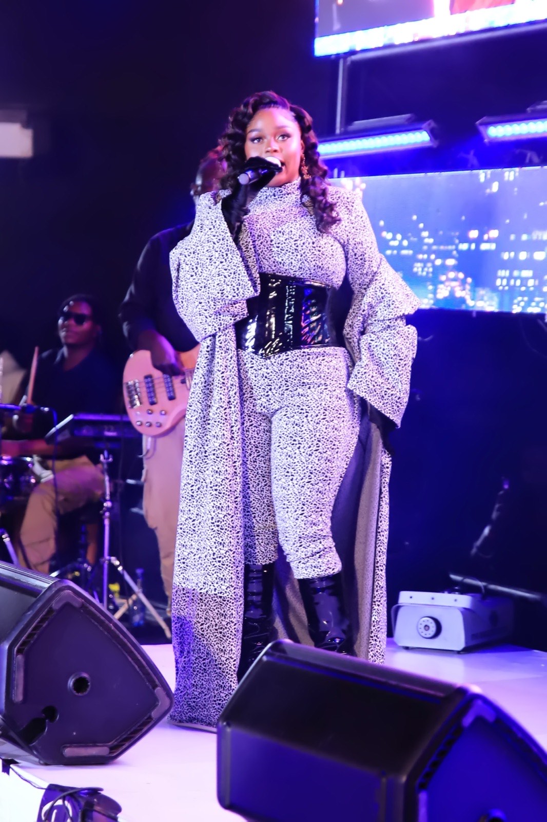 Rema Namakula singing on stage at Tropicanna Poolside