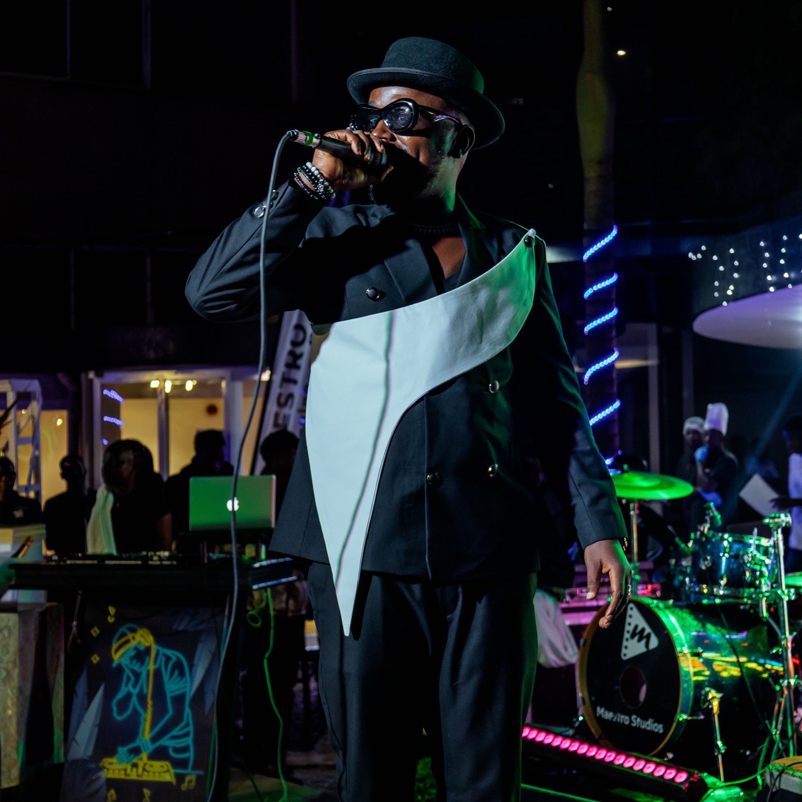 Ykee Benda under stage lights at The Skyz Exclusive