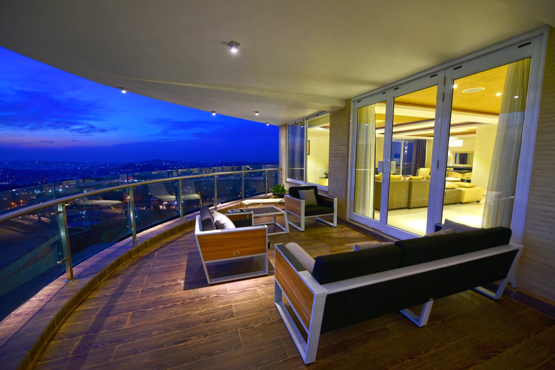 Open-plan suite living and dining area accented with artwork