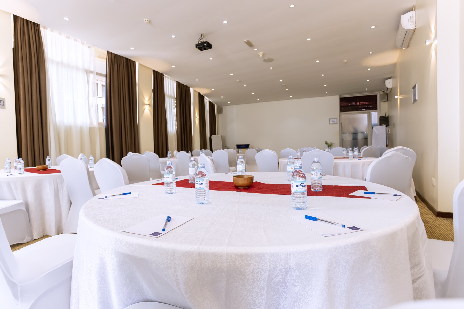 Tokyo Hall set up round-table style with red table runners