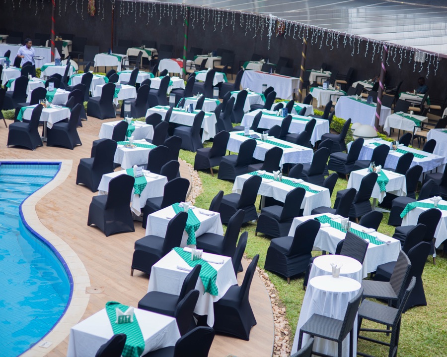 Casual poolside dining tables set beside the pool at Tropicanna Poolside